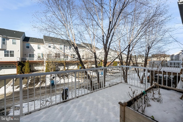 view of snow covered deck