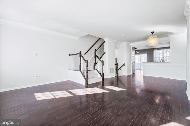 unfurnished living room with crown molding and dark wood-type flooring