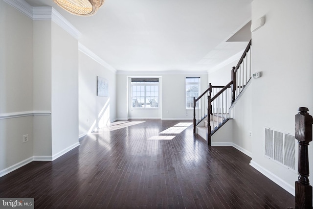 entrance foyer featuring crown molding and dark wood-type flooring