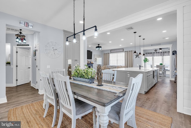 dining room featuring hardwood / wood-style flooring and sink