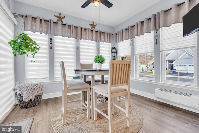 sunroom featuring ceiling fan