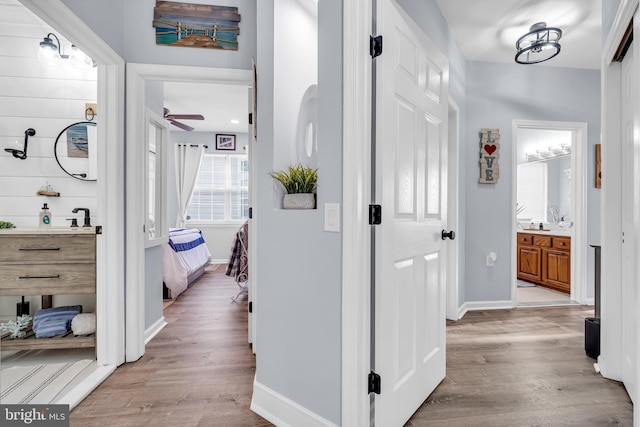 hall with light wood-type flooring