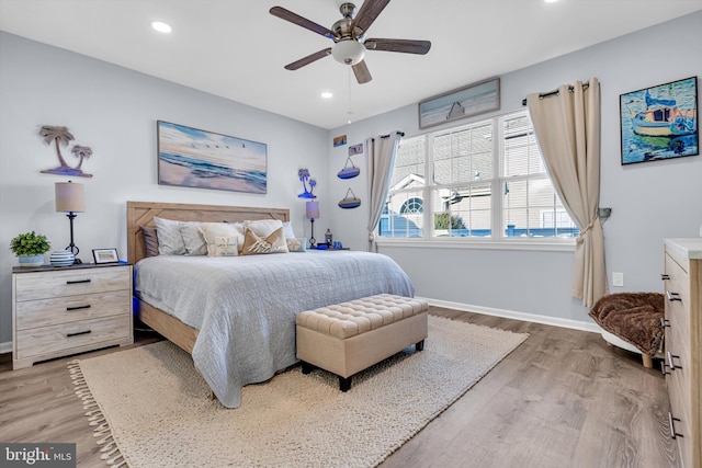 bedroom featuring ceiling fan and hardwood / wood-style flooring