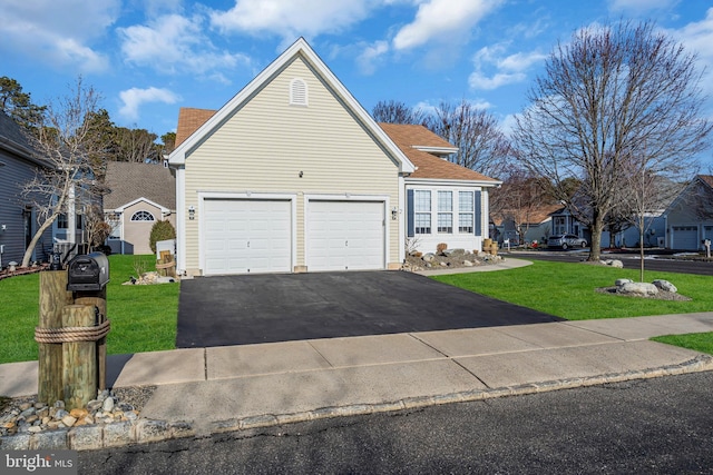 front of property featuring a garage and a front lawn