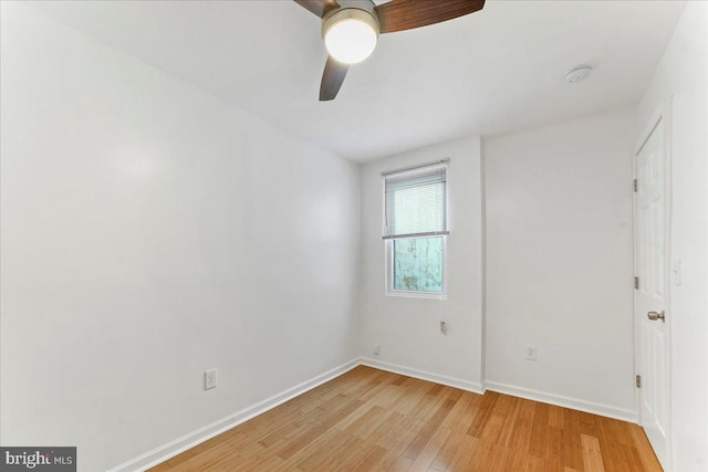 spare room with light wood-type flooring and ceiling fan