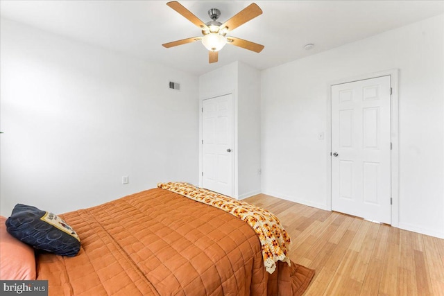 bedroom with ceiling fan and hardwood / wood-style floors