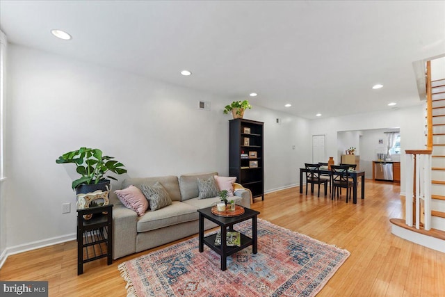 living room with light hardwood / wood-style floors