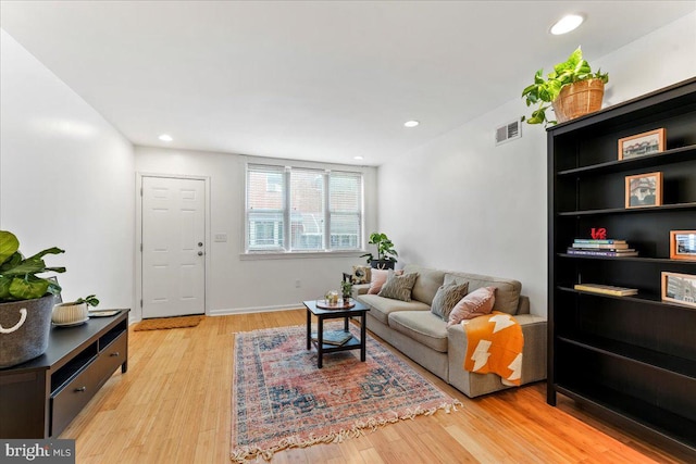 living room with light hardwood / wood-style floors