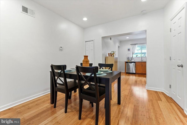 dining space featuring light hardwood / wood-style flooring