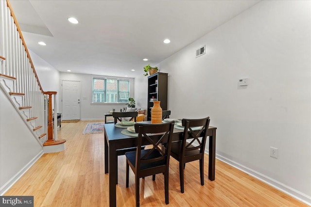 dining room with light wood-type flooring