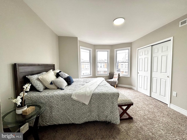 carpeted bedroom featuring a closet