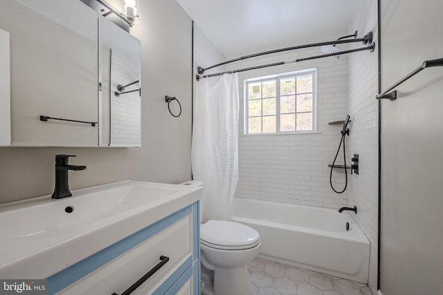 full bathroom featuring shower / bath combo with shower curtain, tile patterned floors, vanity, and toilet