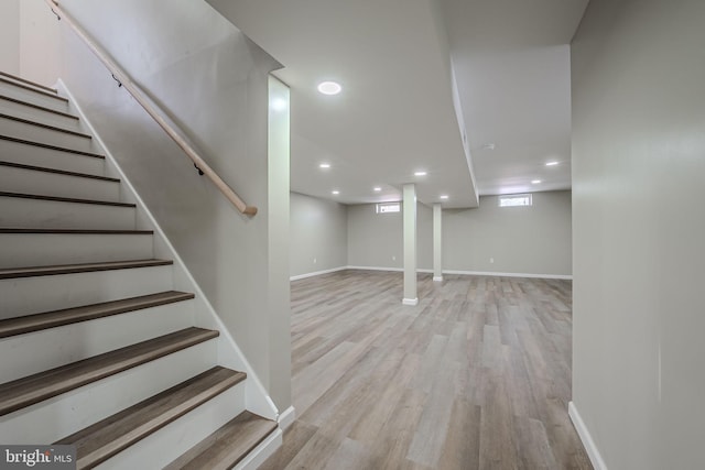 basement featuring light hardwood / wood-style floors