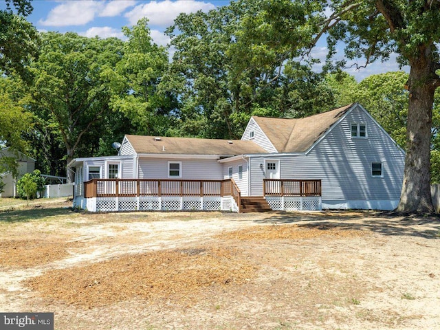 rear view of property with a deck