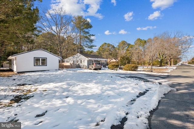 view of yard layered in snow