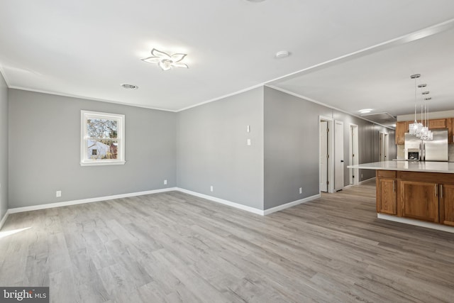 unfurnished living room with light hardwood / wood-style flooring and ornamental molding