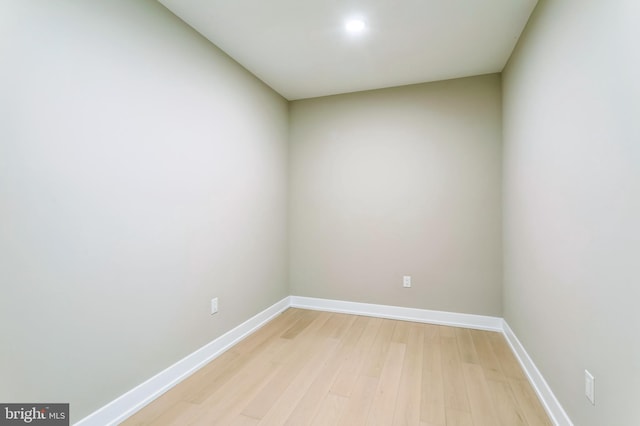 spare room featuring wood-type flooring