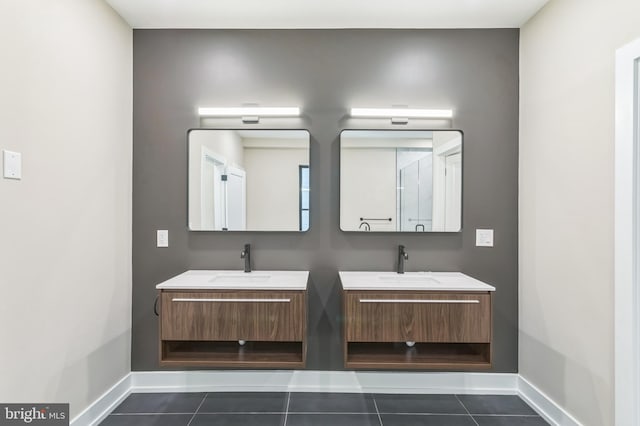 bathroom with tile patterned flooring and vanity