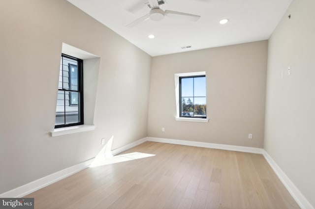 unfurnished room featuring ceiling fan and light wood-type flooring