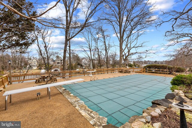 view of swimming pool featuring a patio