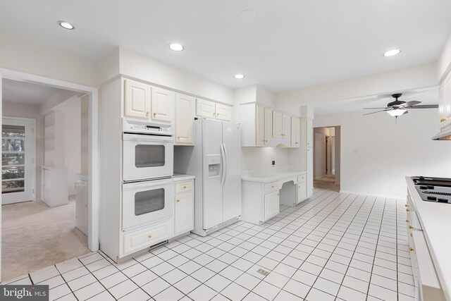 kitchen with white appliances, ceiling fan, light countertops, white cabinetry, and recessed lighting