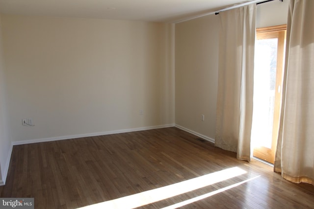 empty room featuring hardwood / wood-style floors