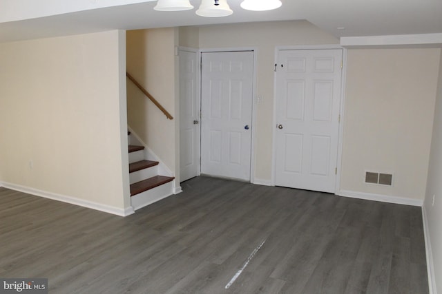 interior space with dark hardwood / wood-style flooring