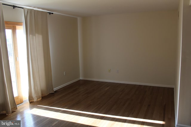 spare room featuring hardwood / wood-style floors