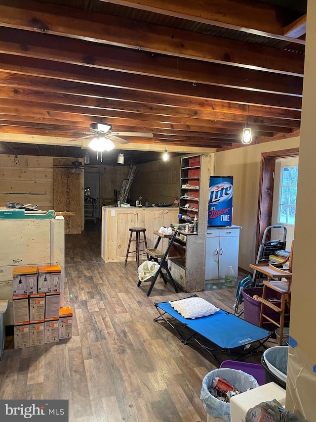 basement featuring wood ceiling, wood walls, and hardwood / wood-style flooring