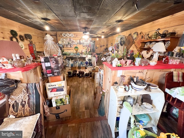 miscellaneous room with ceiling fan, hardwood / wood-style flooring, wood walls, and wood ceiling