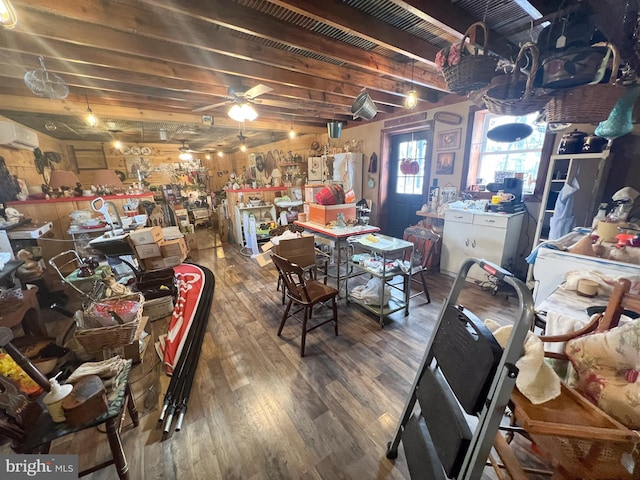 interior space with ceiling fan, hardwood / wood-style floors, and a wall mounted air conditioner