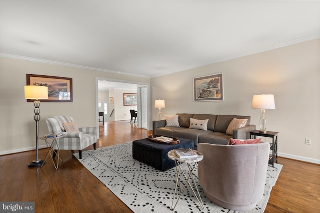 living room with crown molding and hardwood / wood-style floors