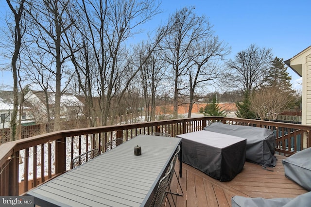 snow covered deck with grilling area