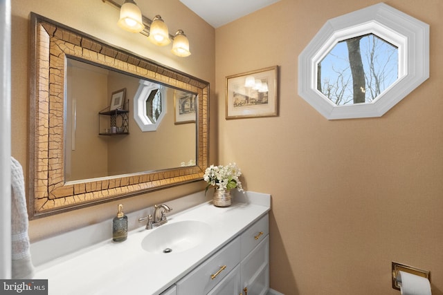 bathroom with plenty of natural light and vanity