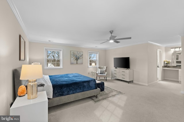 bedroom with ceiling fan, light colored carpet, ensuite bathroom, and ornamental molding