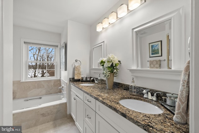 bathroom with vanity and a relaxing tiled tub