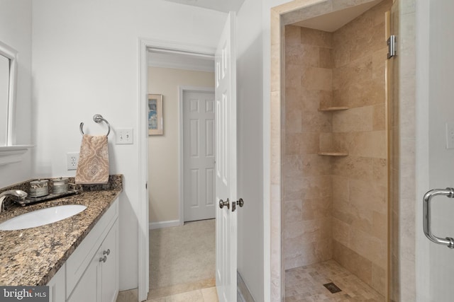 bathroom featuring an enclosed shower and vanity