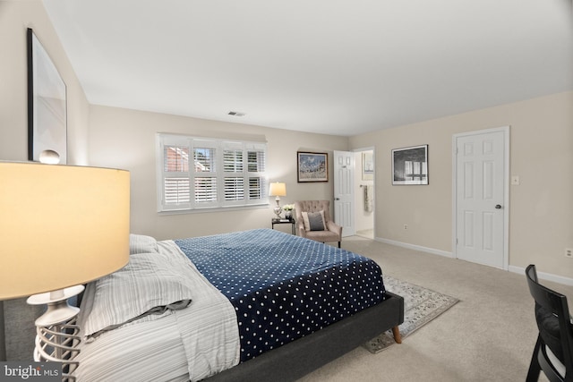 bedroom with light colored carpet