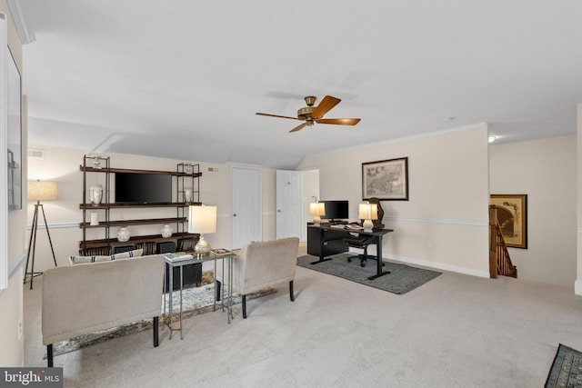 living room featuring ceiling fan, light colored carpet, vaulted ceiling, and ornamental molding