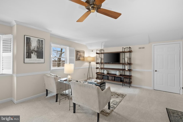 interior space with ceiling fan and crown molding