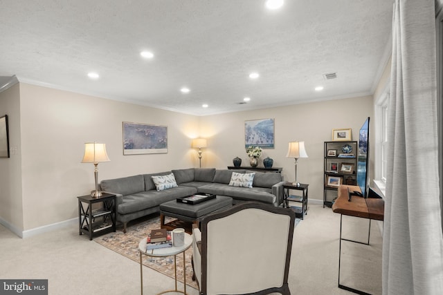 living room with light carpet, ornamental molding, and a textured ceiling