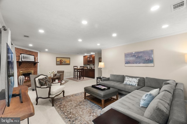 carpeted living room featuring a fireplace and crown molding