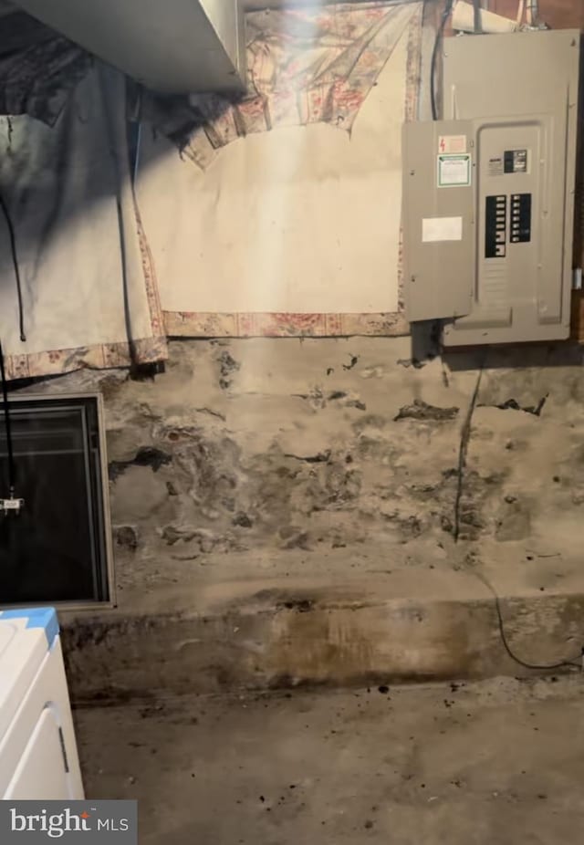 basement featuring electric panel