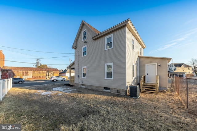 back of property featuring cooling unit