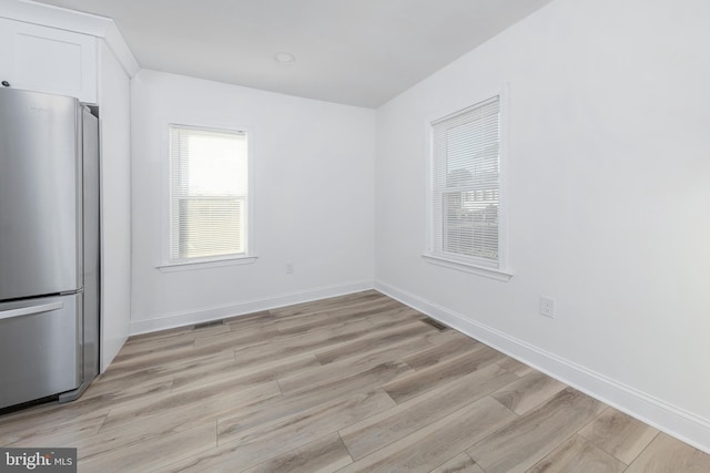 unfurnished dining area with light hardwood / wood-style flooring