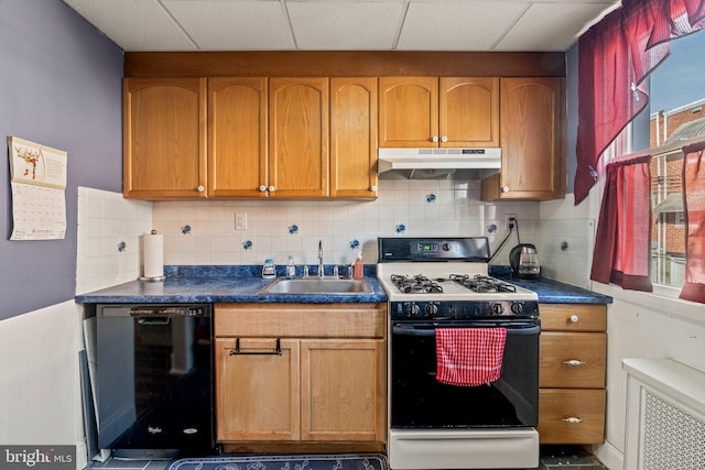 kitchen with gas range gas stove, black dishwasher, backsplash, radiator, and sink