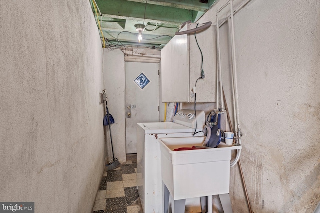 laundry area featuring washer / clothes dryer and sink