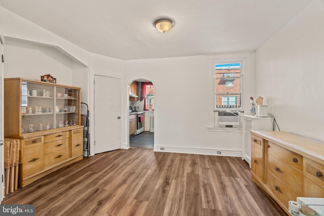 interior space featuring cooling unit and dark wood-type flooring