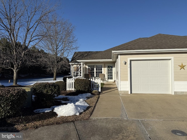 single story home featuring a garage