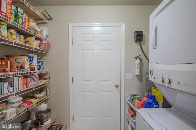 laundry area featuring stacked washer and dryer